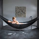 Illustration for article titled This Insane Carbon Fiber Hammock Bathtub Is the Epitome Of Relaxation